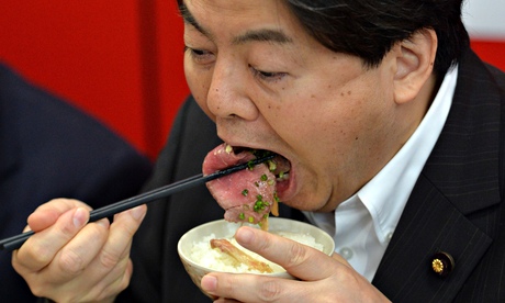 Japan's fisheries minister, Yoshimasa Hayashi, eats whale meat